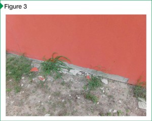Delamination occurred at the bottom of the wall due to improper installation, including poor curing.