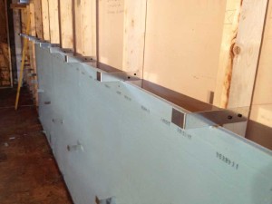 For the project, custom clips were applied to wood studs and then attached to support the drywall following the SPF process.