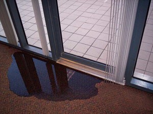 Due to the low threshold and the fact there was no step down to the terrace (an accessible design), water leaked through this door repeatedly during storms, causing interior finish damage inside and on the ceiling below.