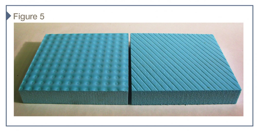 XPS board insulation after compression testing of an assembly incorporating dimple-type (left) and weave-type (right) drainage composite. The insulation surface indentations demonstrate the uneven distribution of load at this interface.