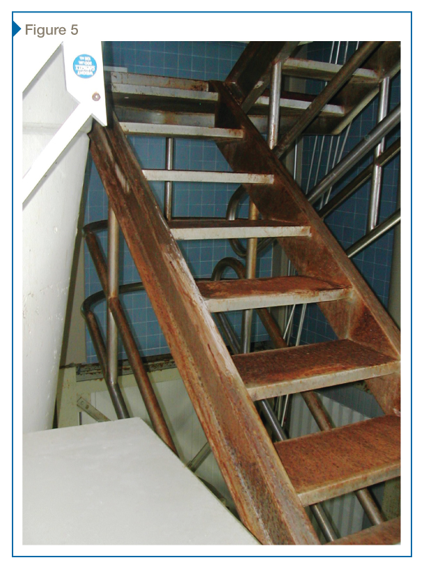 This poorly painted steel diving platform stair experienced heavy corrosion due to direct wetting.