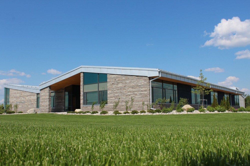 For Grenville Mutual Insurance (Kemptville, Ontario), Shoalts and Zaback Architects wanted elevations to reflect the site’s natural setting—in addition to a handset natural stone façade, there is a customized embossed ‘forest’ pattern created by formliners. SiteCast Construction Corp. installed the panels.