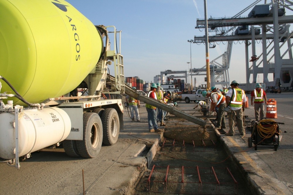 This image shows placement of activated fly-ash cement concrete at the Port of Savannah—an application where concrete will be subjected to abrasion and loads of 55,791 kg (123,000 lb) from overhead mobile gantry cranes.