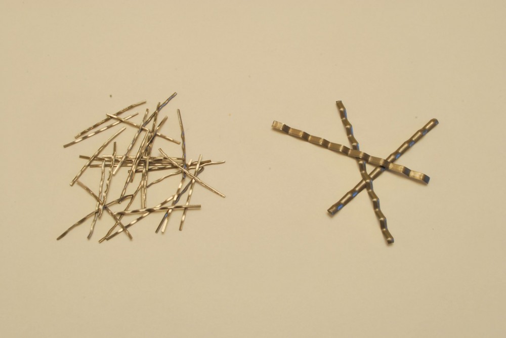 Both piles have the same mass, but the 25-mm (1-in.) fibers outnumber the 50-mm (2-in.) fibers almost eight to one.