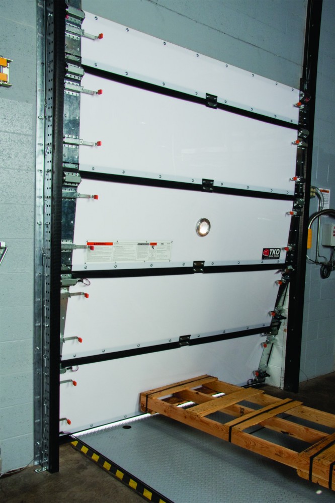 Impactable doors with wind load still protect against forklift impacts.