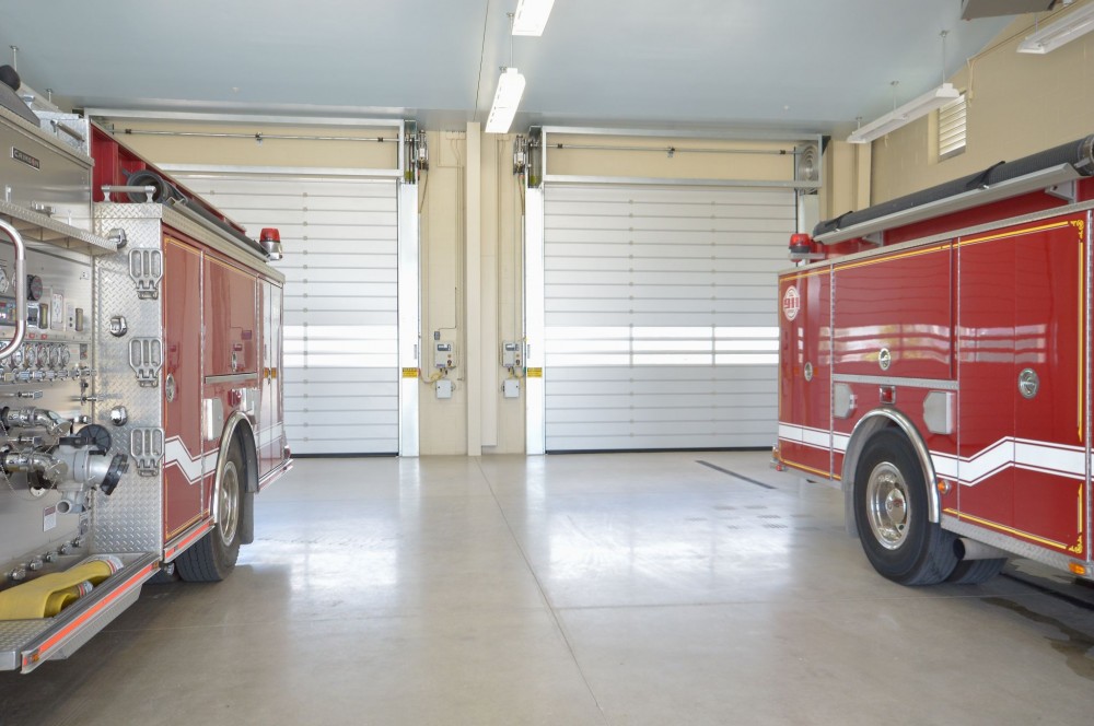 High-performance security doors (HPSD) open fast and allow for quick exit of emergency vehicles from fire stations.