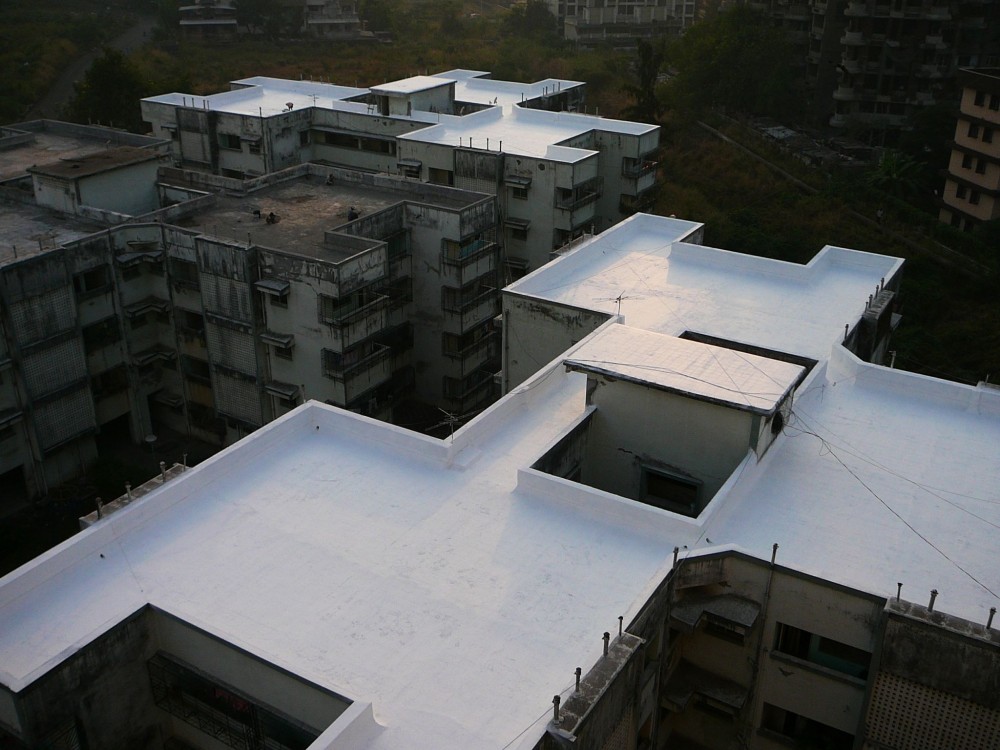 A reflective acrylic coating was used to offer roof protection and yield energy savings at this Bank of India building in Mumbai, India. Photo courtesy Quest Construction Products