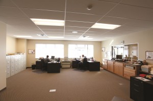 In an effort to decrease the amount of artificial light needed and control heating costs, all offices were located on the outer perimeter, and a clerestory runs the entire length of the facility.