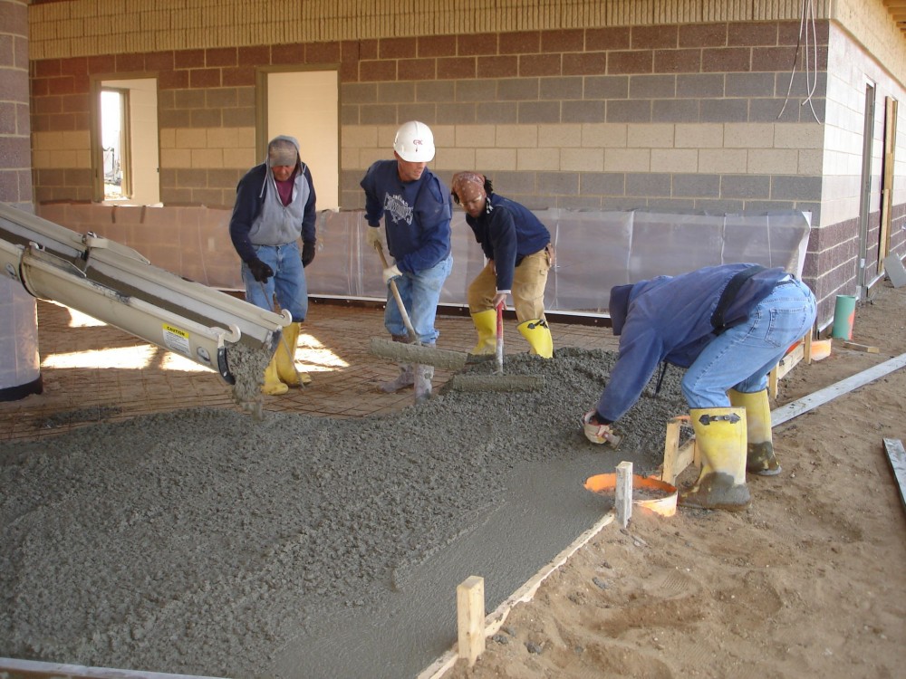 Low water-to-cement concrete is harder to move around and requires considerably more handwork to get it in place. Placement and spreading of low water-to-cement ratio concrete can be improved by adding water-reducing admixtures (WRAs)—however, excessive use can cause more drying shrinkage. These are rarely required by the specification, but are included in the specification as an alternate product that may be used.