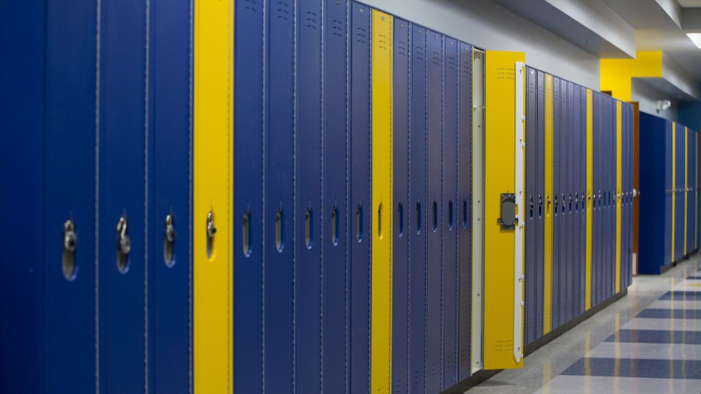 The high-density polyethylene (HDPE) lockers in Cologne Academy (Cologne, Minnesota) are fire-rated for corridors, selected in the school colors of yellow and blue. Photos courtesy Scranton Products 