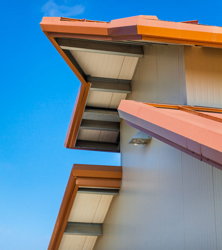 The building’s exposures are positioned so photovoltaic (PV) panels, installed atop the roof panels, reduces the energy the facility requires off the grid.