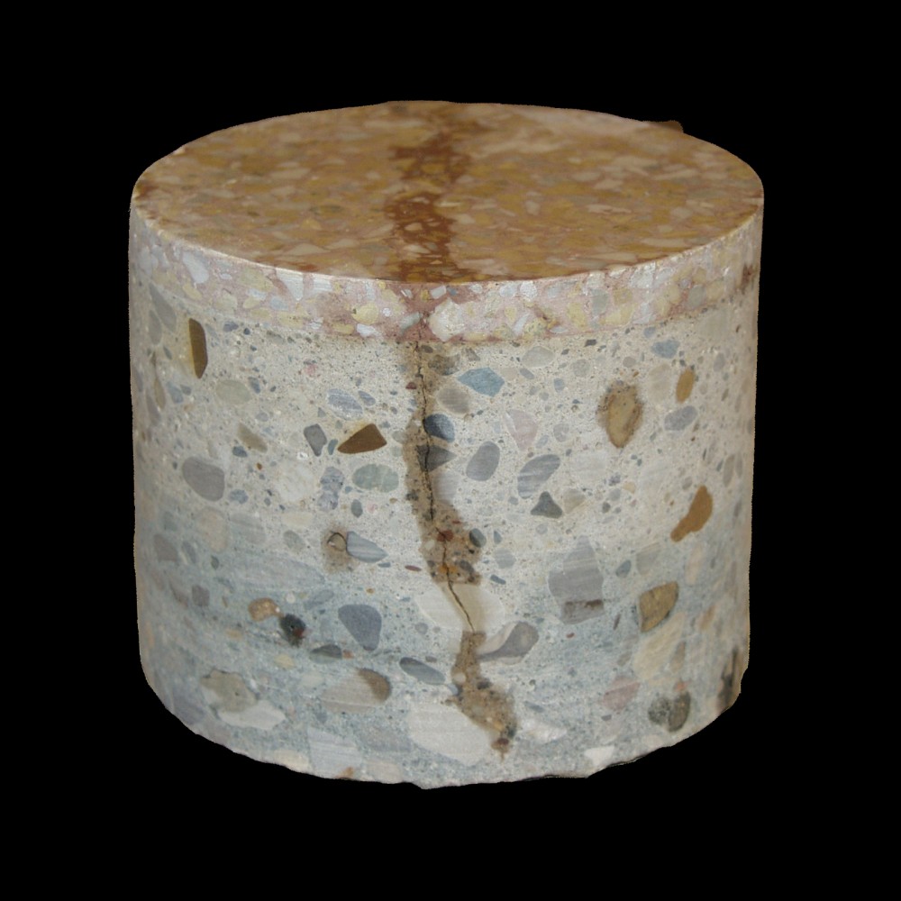 This shrink crack telegraphed through the thin-set terrazzo and became the subject of litigation and costly court-ordered repairs. (A core sample can be seen at right/below.)