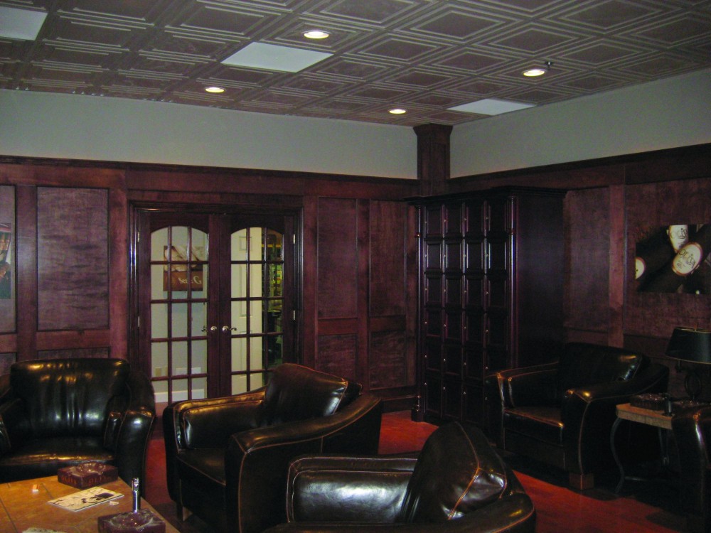 Thermoformed ceiling panels complement the panelized wood walls and doors to enhance the decorative motif of this cigar lounge. The ceiling panels do not absorb odors from cigar smoke and can be washed to remove tobacco stains.