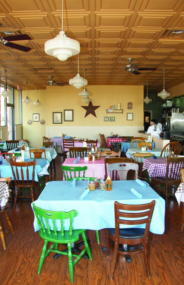 Faux wood grain and molded surface of ceiling add to the charm and down-home comfort of a café. Thermoformed ceiling tiles can extend over culinary areas because hygienic surfaces meet Food & Drug Administration (FDA) requirements for food-handling facilities.