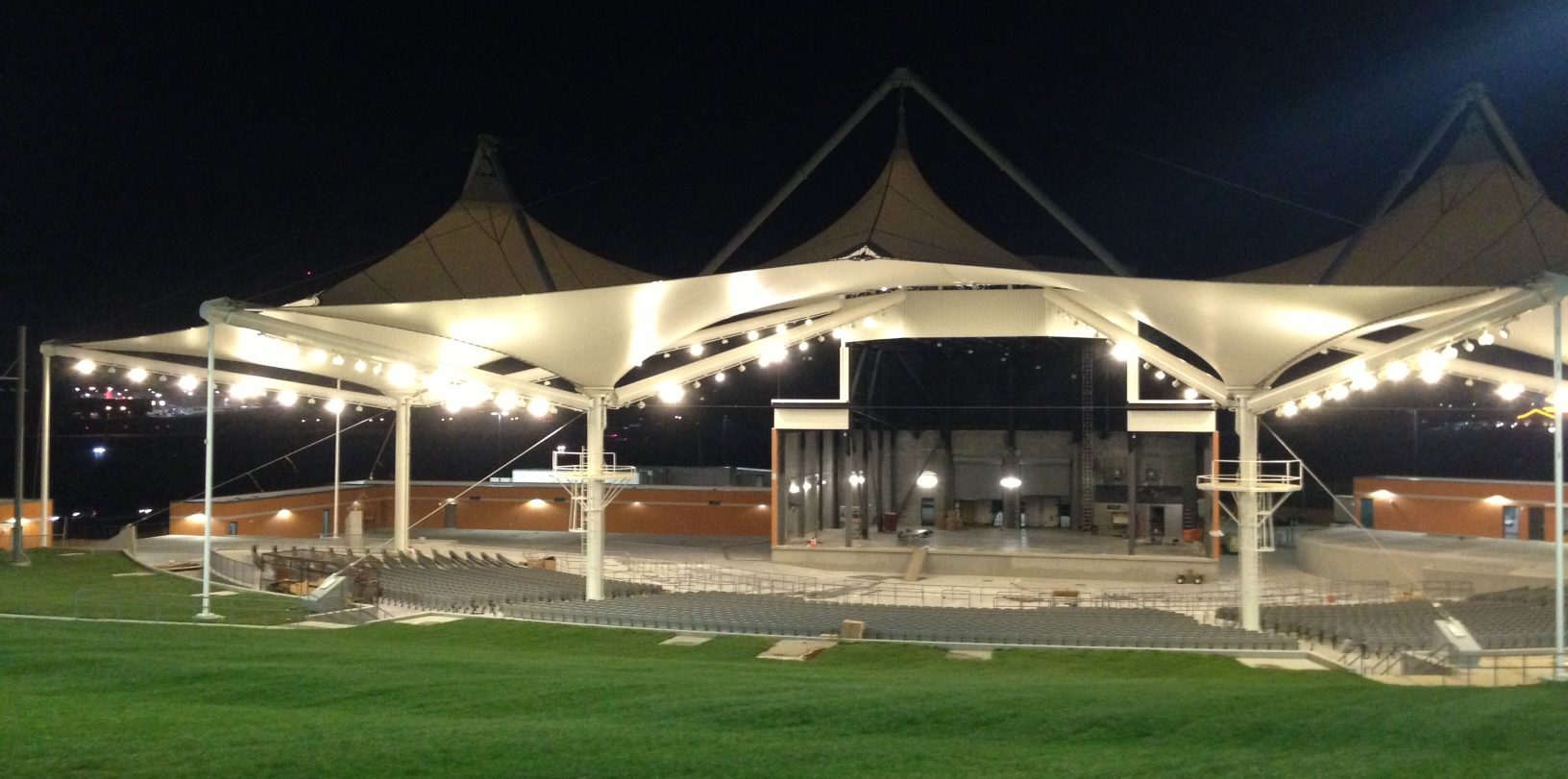 This photo shows a view of the Arkansas Music Pavilion at night. The polytetrafluoroethylene (PTFE) cone structures come to life with lighting, while at the same time protect concert attendees. Photos courtesy Birdair