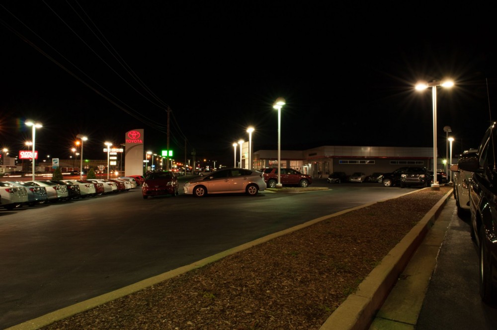 These photos show Gary Force Toyota’s lot illuminated with traditional metal halide fi xtures. A total of 63 of the 1000- W fi xtures were replaced with 240-W light-emitting diode (LED) luminaries for dramatic energy savings.