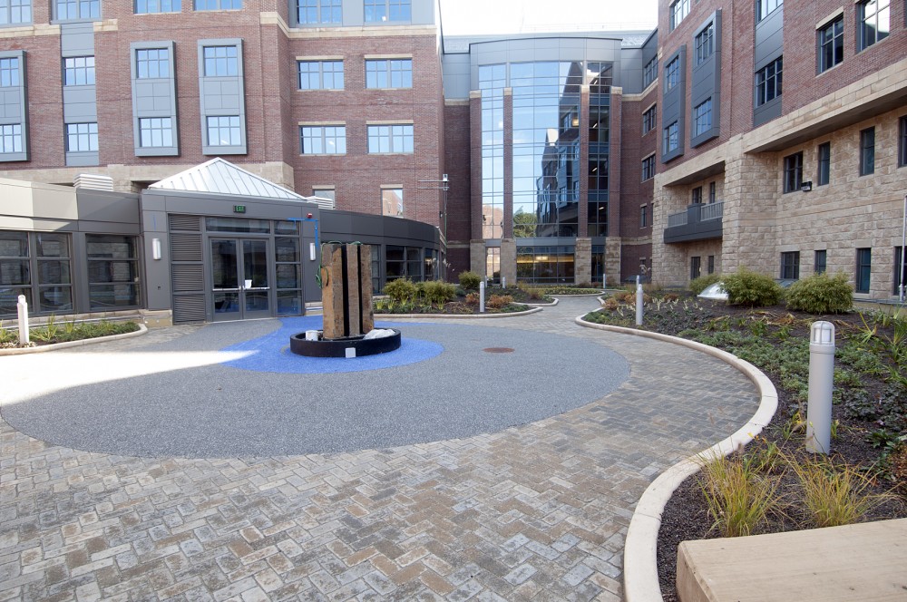 The healing garden is finished with ballasted stone, low vegetation and paver walkways.