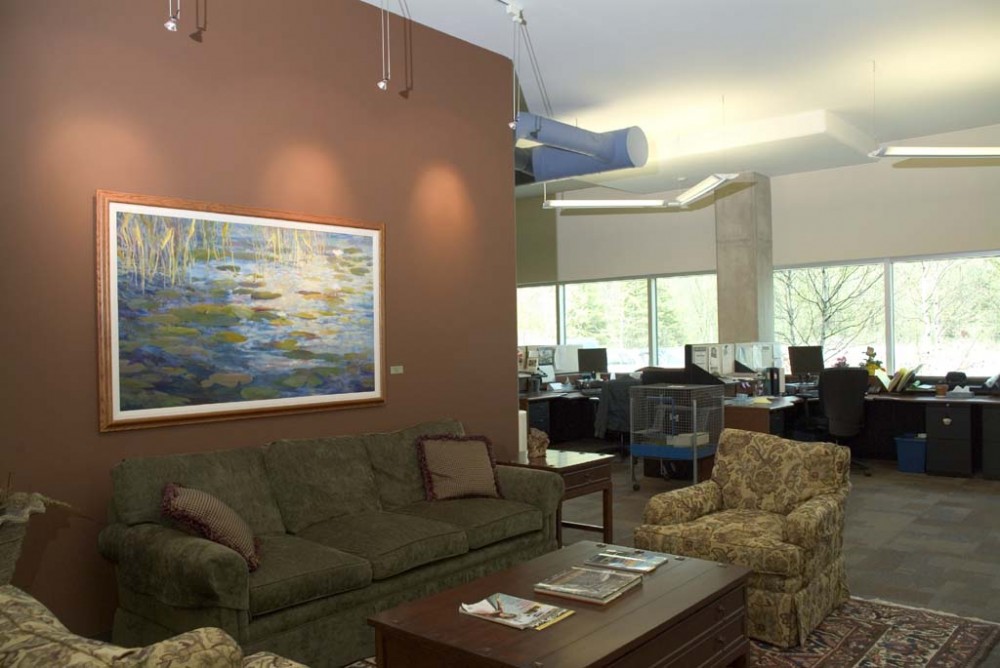 Specifiers integrated the engineering functionality of an exposed concrete radiant-cooled ceiling with the architectural vision of exposed ductwork and drop lighting to provide a collaborative feel within the interior space at Earth Rangers Centre in Woodbridge, Ontario. [CREDIT] Photo courtesy Klimatrol Environmental Systems 