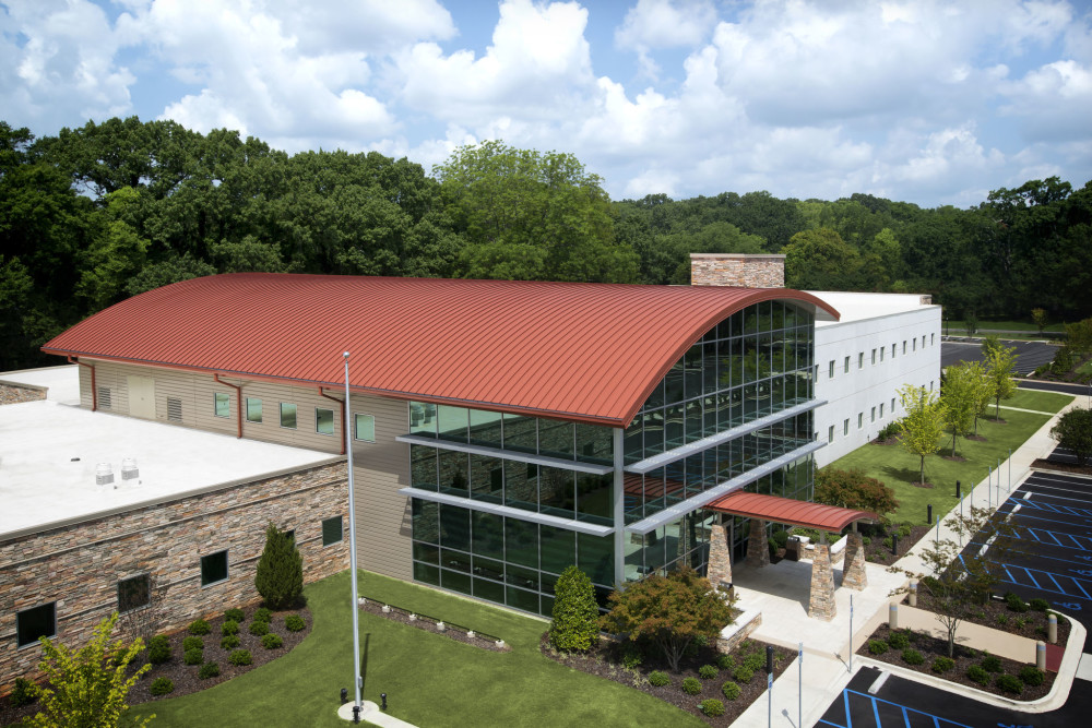The new Western Health Center (Midfield, Alabama) is a two-story facility that features proprietary mechanically seamed 50-mm (2-in.) metal roofing panels. Photo courtesy Petersen Aluminum