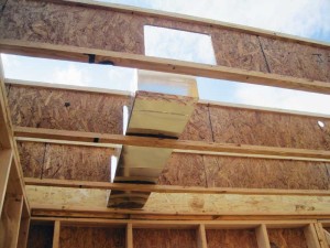 Pre-planning and pre-cutting holes in I-joists as shown on this project site, can help reduce installation time and mistakes.