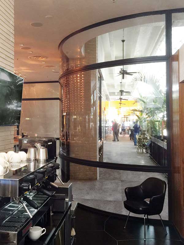 This interior curved on-plane glass in a restaurant,
The Grill at Bal Harbour, is 4-m (13-ft) wide and 3.6-m (12-ft) high. The assembly was made possible due to the hot-rolled steel framing. Photo courtesy Dencon Architectural