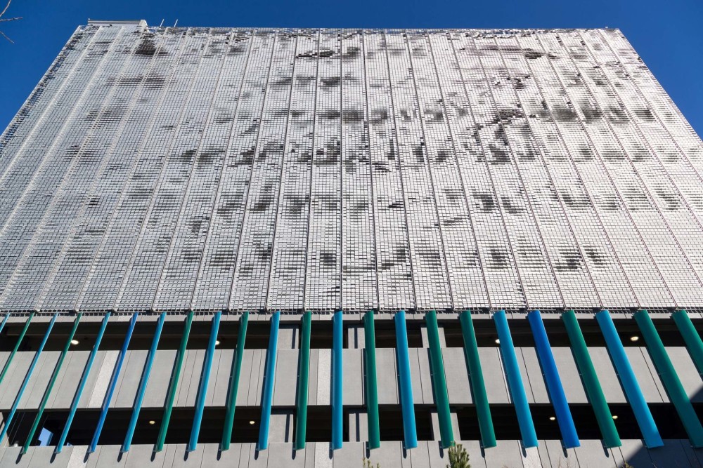 The façade of Boston Logan International Airport’s new 10-story West Garage Extension comprises more than 48,000 aluminum flapper panels that move with the wind. Photos courtesy EXTECH and Linetec.