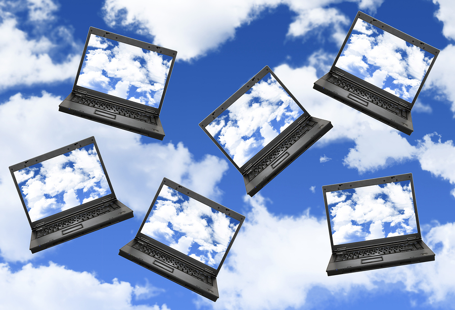 Cloud computing concept with laptops in the sky