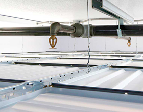 Why fire sprinklers belong above suspended drop-out ceilings