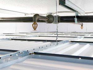 Why fire sprinklers belong above suspended drop-out ceilings