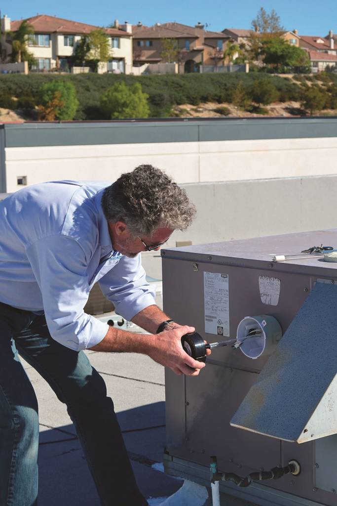 Figure 7: Replacing a single-ended lamp in a rooftop air-conditioning unit is relatively simple.
