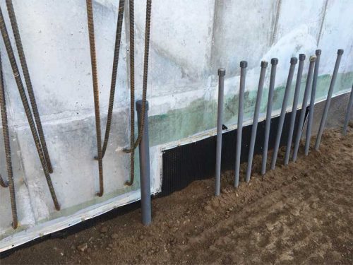 Figure 5: A rigid metal (aluminum or stainless steel) bar is employed to terminate the self-adhered rubberized-asphalt sheet membrane at grade, ensuring the durability of the waterproofing system.