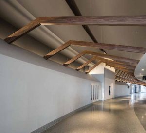 Wall and ceiling attachments, in conjunction with thin cables, were used to provide structural support for the beams at the Nassau Coliseum.