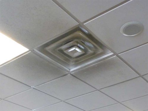 Figure 7: Particulates in air supply tend to cling to adjacent ceiling surfaces due to Coandã effect. Soot, at this international airport, is particularly hard to remove from crevices and pores in mineral fiber panels.