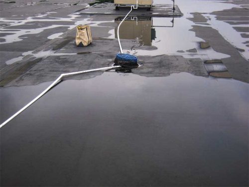 Figure 3: Pull-back view of a single roof drain (located between RTUs one and two). The drain bowl and the surrounding sump are at a higher elevation than the finished surface of the ethylene propylene diene monomer (EPDM) roof system.