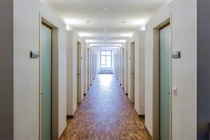 A common location for 20-minute fire door assemblies is a residential corridor leading to dwelling or sleeping units.