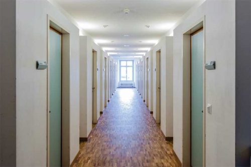 A common location for 20-minute fire door assemblies is a residential corridor leading to dwelling or sleeping units.