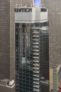 A custom-engineered and vertically oriented metal screenwall assembly helps create a modern silhouette for the Marriott Edition hotel in Times Square, New York City. Photo courtesy Metalwërks