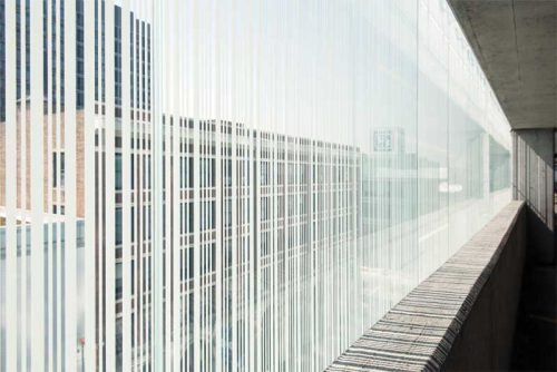 The custom pattern-fritted glass provides solar shading, while maintaining occupants’ visibility to the outside.