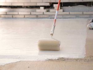 Spiked rollers are used on the thicker layers of a polymethyl methacrylate/polyurethane methacrylate (PMMA/PUMA) coating system to de-train air that may have been created during the mixing process.