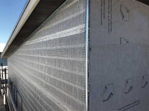 Located in front of a spun-bonded polypropylene, self-adhering air- and water-resistive barrier, the rainscreen system featured a drainage and ventilation layer in one, but also incorporates the lath for the first scratch coat of the stucco.
