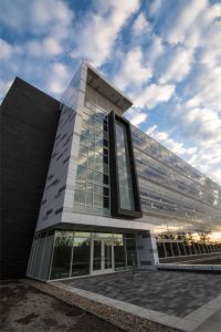 The high-performance curtain wall at the Michigan State University’s bioengineering facility helps lower heating and cooling costs. Its exterior design by Integrated Design Solutions corresponds with the activity taking place inside where the communal spaces are represented by tall sections of curtain wall and the workstations by the shorter sections. Photo © Integrated Design Solutions, Kevin S. Marshall. Photo courtesy Valspar