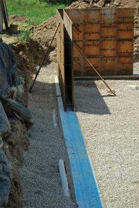 Installation of a footing barrier.