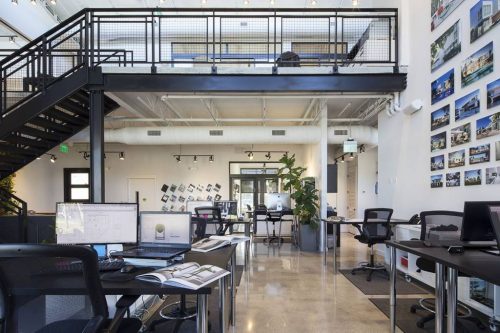 The SDH + TREO office building was designed as a modern, spacious, two-story structure with a double-height open-plan.