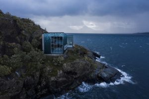 Located in the village of Skutvik, Norway, the striking modern structure for the Arctic Salmon Center is clad in panels that create the illusion of Nordic salmon scales. Photo courtesy Steni