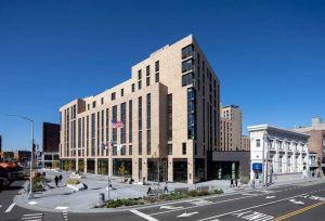 Each building participates in an approach to the scale and character of the neighborhood. Here, the design enhances the street level.