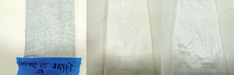 Three vertical material samples displayed on a flat surface, labeled with blue tape, showing varying textures and finishes.