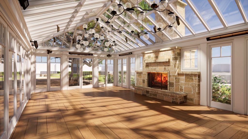 A spacious sunroom featuring a cozy fireplace and elegant wood floors, creating a warm and inviting atmosphere.