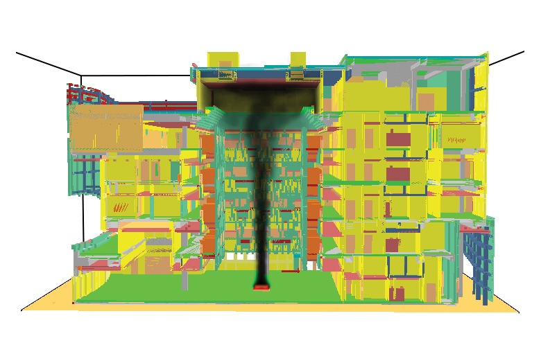 Colorful abstract building model with vibrant green, yellow, and pink sections. A central black column suggests rising smoke or airflow.