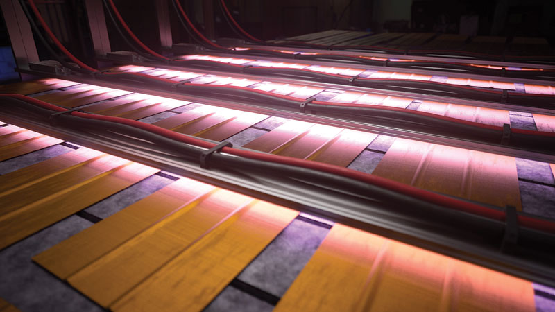 A close-up view of wooden planks resting on a dark surface, illuminated by parallel pink glowing cables underneath.